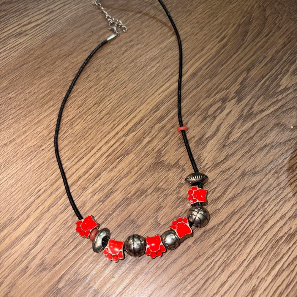 Red and silver paw print necklace with red paw print beads and silver bead